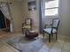 Cozy sitting area with two armchairs and coffee table at 3912 Fontainebleau Dr, Tampa, FL 33634