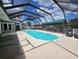 Inviting pool area with covered patio and lounge chairs at 3912 Fontainebleau Dr, Tampa, FL 33634