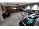 Spacious living room with leather furniture and built-in entertainment center at 3912 Fontainebleau Dr, Tampa, FL 33634