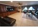 Spacious living room with leather furniture and built-in entertainment center at 3912 Fontainebleau Dr, Tampa, FL 33634