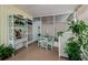 Relaxing screened porch with seating area at 120 Melody Ln, Tarpon Springs, FL 34689