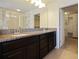 Bathroom with granite countertop double vanity, and separate shower at 15250 Anguilla Isle Ave, Tampa, FL 33647