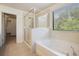 Bathroom features a large garden tub and separate shower at 15250 Anguilla Isle Ave, Tampa, FL 33647