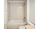Clean bathroom with a bathtub, shower, and tile surround at 15250 Anguilla Isle Ave, Tampa, FL 33647