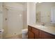 Clean bathroom with shower/tub combo and wood vanity at 15250 Anguilla Isle Ave, Tampa, FL 33647