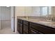 Bathroom with granite countertop double vanity at 15250 Anguilla Isle Ave, Tampa, FL 33647