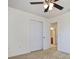 Spacious bedroom with neutral walls, carpet flooring, and double door closet at 15250 Anguilla Isle Ave, Tampa, FL 33647