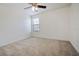Bright bedroom with neutral walls, carpet flooring, and ceiling fan at 15250 Anguilla Isle Ave, Tampa, FL 33647