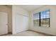 Bedroom with double door closet and window with blinds at 15250 Anguilla Isle Ave, Tampa, FL 33647