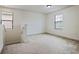 Upstairs bedroom with window, neutral walls, and carpet at 15250 Anguilla Isle Ave, Tampa, FL 33647
