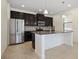 Modern kitchen with stainless steel appliances and granite countertops at 15250 Anguilla Isle Ave, Tampa, FL 33647