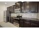 Modern kitchen with stainless steel appliances and granite countertops at 15250 Anguilla Isle Ave, Tampa, FL 33647
