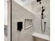 Spa-like shower with modern fixtures and pebble accents at 5542 Atlantic N Ave, St Petersburg, FL 33703