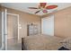 Inviting bedroom with carpet flooring, closet for storage, and a ceiling fan at 6240 Bayside Dr, New Port Richey, FL 34652