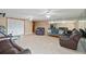 Expansive living room with tile flooring and abundant seating with mirrors, plus extra space at 6240 Bayside Dr, New Port Richey, FL 34652