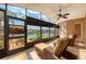 Sunroom with views of the water, lounge chairs and an open concept to let in natural light at 6240 Bayside Dr, New Port Richey, FL 34652