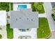Top-down view of the house, showing its layout and landscaping at 83 Palm Blvd, Dunedin, FL 34698