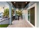 Spacious back patio with wood ceiling, light blue walls, and sliding glass doors at 83 Palm Blvd, Dunedin, FL 34698