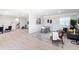 Finished basement recreation room with foosball table, comfortable seating, and hardwood floors at 83 Palm Blvd, Dunedin, FL 34698