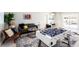 Game room with foosball table, comfortable seating, and pool view at 83 Palm Blvd, Dunedin, FL 34698