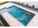 Relaxing rectangular swimming pool with grey pavers at 83 Palm Blvd, Dunedin, FL 34698