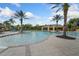 Community pool with a shallow area and lounge chairs at 15250 Anguilla Isle Ave, Tampa, FL 33647