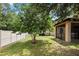 Large backyard with a screened patio and a privacy fence at 15250 Anguilla Isle Ave, Tampa, FL 33647