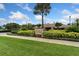 Inviting entrance to the Beach Club with landscaping at 15250 Anguilla Isle Ave, Tampa, FL 33647