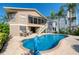 Private pool and patio with outdoor kitchen and canal views at 6240 Bayside Dr, New Port Richey, FL 34652
