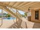 Elevated view of the backyard pool area with stairs and patio at 6240 Bayside Dr, New Port Richey, FL 34652