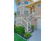 Two-story house exterior with white stairs and landscaping at 6240 Bayside Dr, New Port Richey, FL 34652