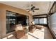 Screened porch features wicker furniture and views of the canal at 6240 Bayside Dr, New Port Richey, FL 34652