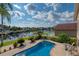 Inviting pool with water view and patio at 6240 Bayside Dr, New Port Richey, FL 34652