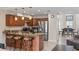 Open kitchen with granite countertops, stainless steel appliances, and an island at 6240 Bayside Dr, New Port Richey, FL 34652