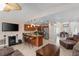 Living room features a stone fireplace and sliding doors leading to the outdoors at 6240 Bayside Dr, New Port Richey, FL 34652