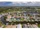 Wide aerial showcasing waterfront community, homes, canals, and boats at 6240 Bayside Dr, New Port Richey, FL 34652