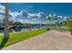 Spacious backyard with paver patio and canal views at 6240 Bayside Dr, New Port Richey, FL 34652