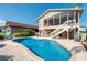 Relaxing kidney-shaped pool with patio and canal view at 6240 Bayside Dr, New Port Richey, FL 34652