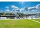 Waterfront backyard with private dock and lush grass at 6240 Bayside Dr, New Port Richey, FL 34652
