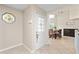 Bright entryway with view into dining area and stained glass at 6240 Bayside Dr, New Port Richey, FL 34652