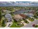 Aerial perspective of a waterfront home neighborhood, featuring houses and canals at 6240 Bayside Dr, New Port Richey, FL 34652