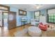 Relaxing bedroom with light blue walls, hardwood floors, and comfortable seating at 516 Gulf Blvd, Indian Rocks Beach, FL 33785