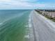 Expansive aerial view of beach with ocean waves at 516 Gulf Blvd, Indian Rocks Beach, FL 33785