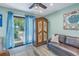 Comfortable living area with leather couch and antique armoire at 516 Gulf Blvd, Indian Rocks Beach, FL 33785