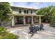 Two story house exterior with a large front porch and patio area at 516 Gulf Blvd, Indian Rocks Beach, FL 33785