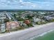 Aerial view showing home's location near beach and other properties at 516 Gulf Blvd, Indian Rocks Beach, FL 33785