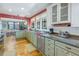 Open kitchen with granite countertops and stainless steel appliances at 516 Gulf Blvd, Indian Rocks Beach, FL 33785