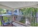 Private balcony overlooking backyard and neighboring property at 516 Gulf Blvd, Indian Rocks Beach, FL 33785