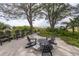 Relaxing patio with ocean views, surrounded by lush landscaping and comfortable seating at 516 Gulf Blvd, Indian Rocks Beach, FL 33785