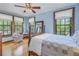 Cozy bedroom with hardwood floors, a queen-size bed, and plenty of natural light at 516 Gulf Blvd, Indian Rocks Beach, FL 33785